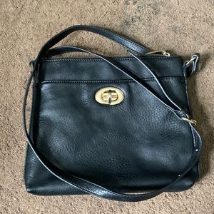 Coach purse. Small to medium size. 3 zippers and 1 clasp.